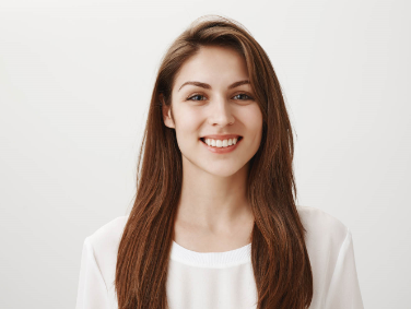 friendly smiling woman looking pleased front